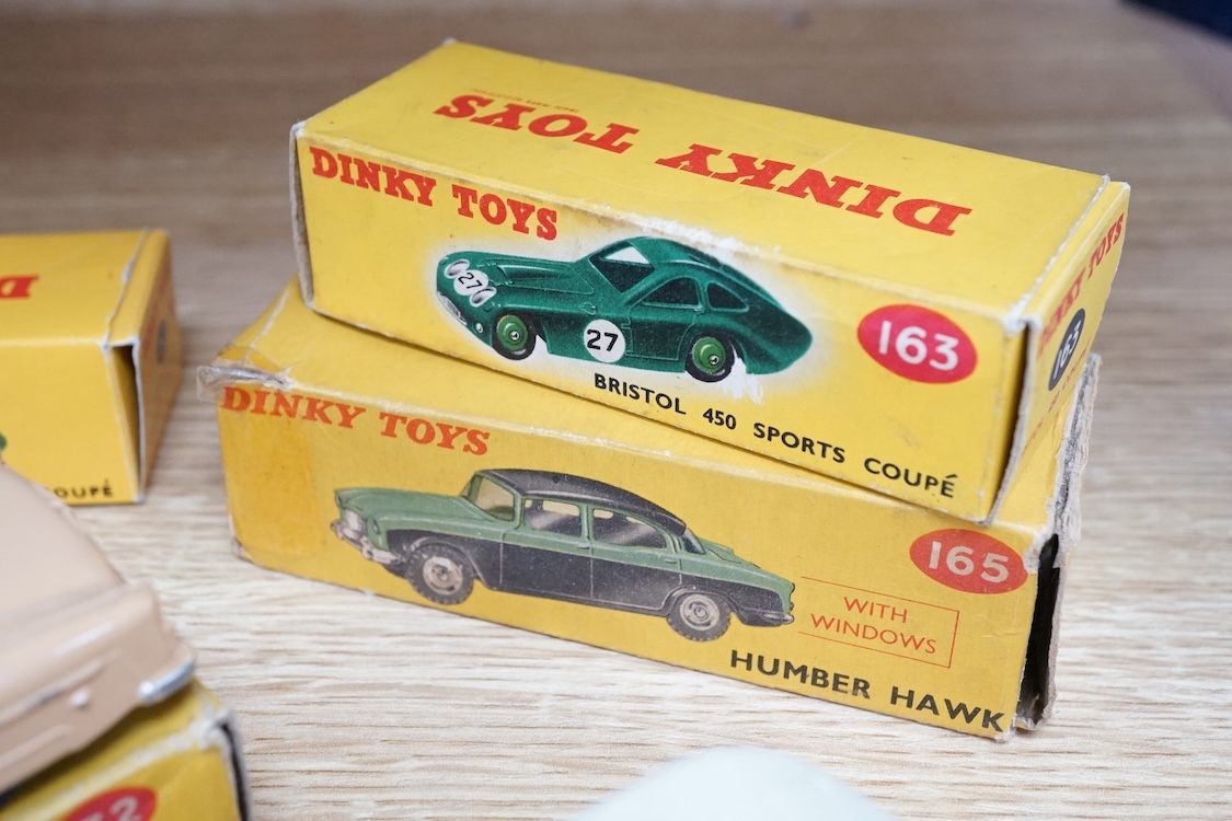 Six boxed Dinky Toys cars; Cunningham C-5R (133), Jaguar 3.4 saloon (195) in grey, Packard convertible (132) in fawn, Jaguar XK120 (157) in dark red (in a reproduction box), Humber Hawk (165) in two-tone green and black,